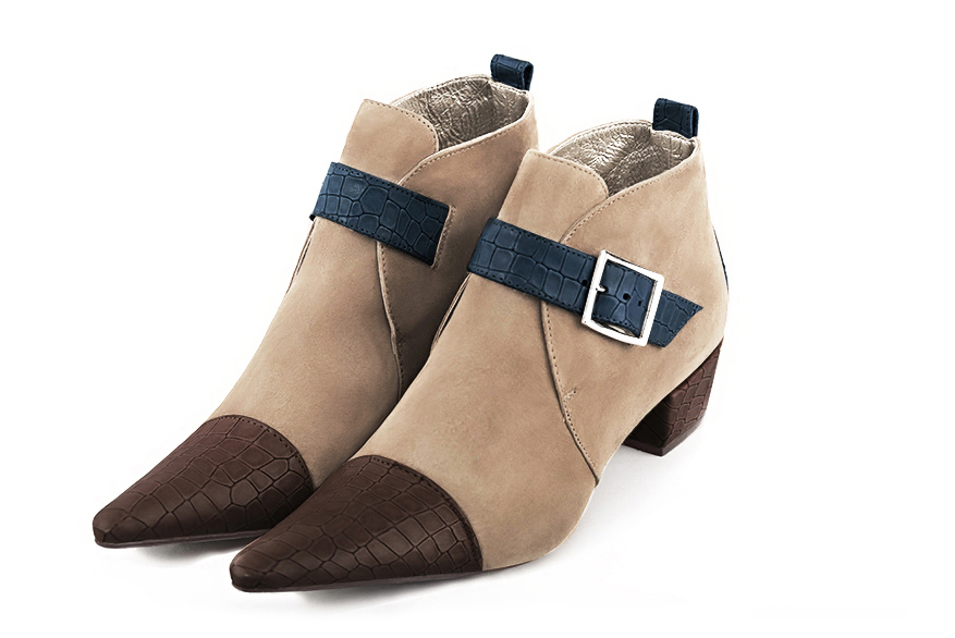 Women's dark brown, tan beige and denim blue elegant ankle boots, with buckles at the front. Pointed toe. Low cone heels - Front view